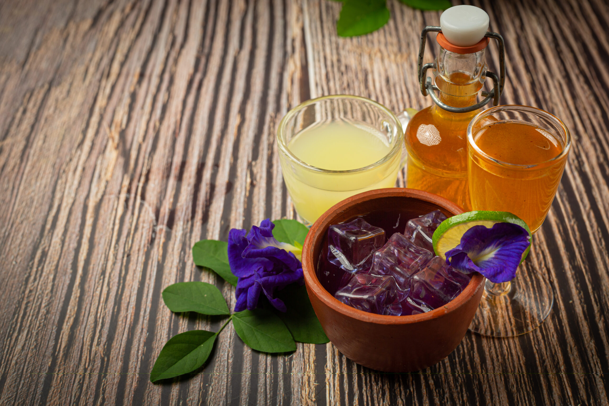 Healthy drink, organic blue pea flower tea with lemon and lime.